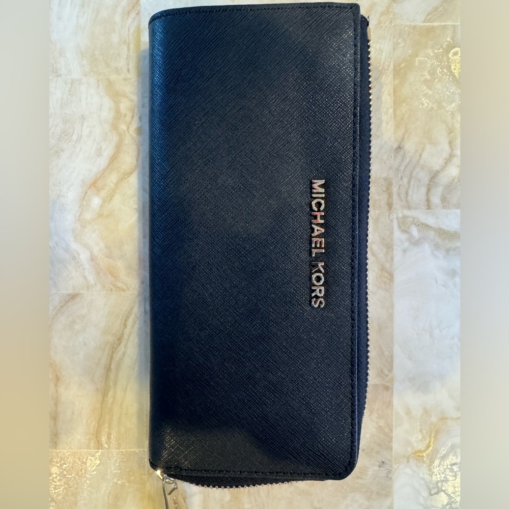 One Michael Kors women’s wallet